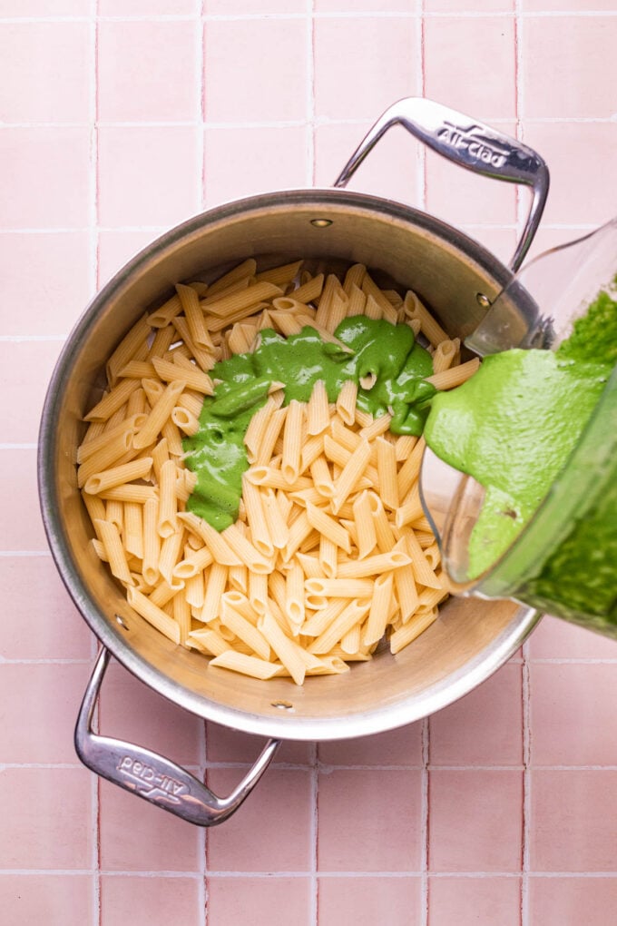 green sauce poured into pasta